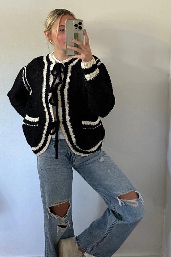 Knitted lace-up pocket sweater coat, black with white striped trim and lace-up neckline