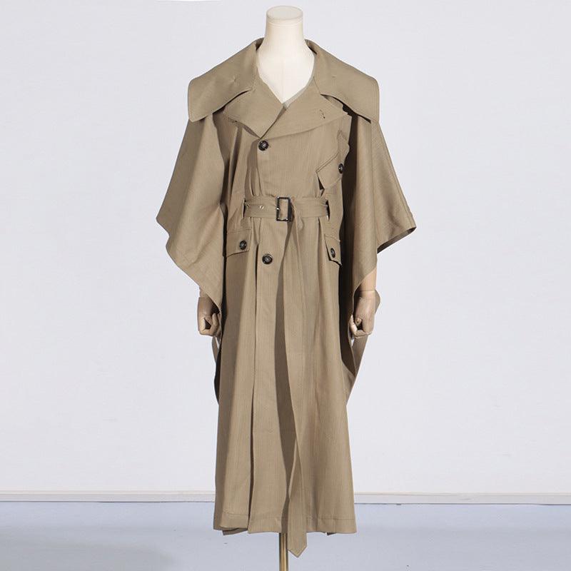 Khaki long trench coat with cape sleeves, buckled belt, button details and flap pockets.