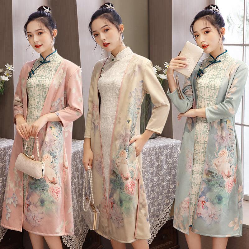 Pastel pink cheongsam-style dress with blue trim and floral print, long sleeves