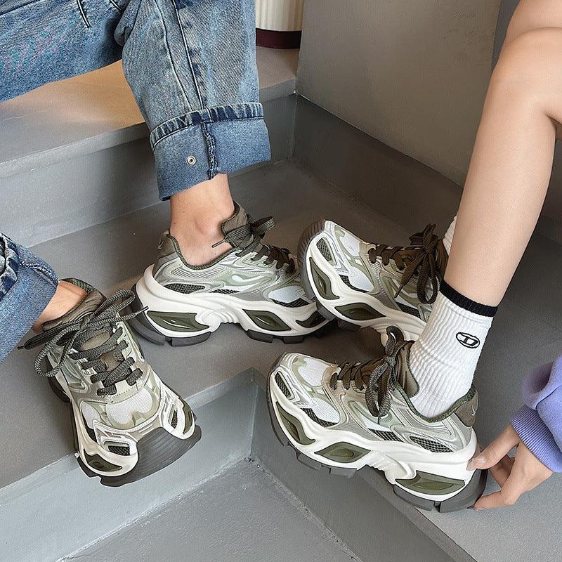 White and olive chunky dad shoes with lace-up front and molded tread sole