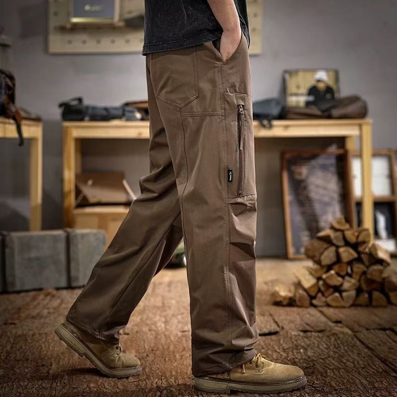 Brown paratrooper cargo trousers with side zip pocket and utility cargo panels