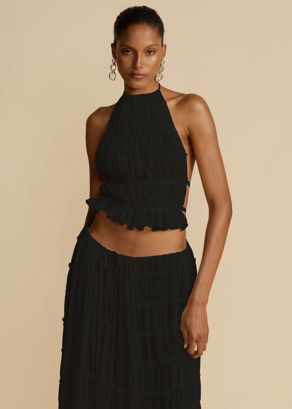 Two-piece halter cropped top and pleated long skirt set, black