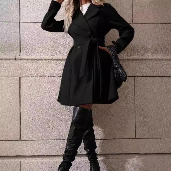 Women's long black belted coat with button front and long sleeves