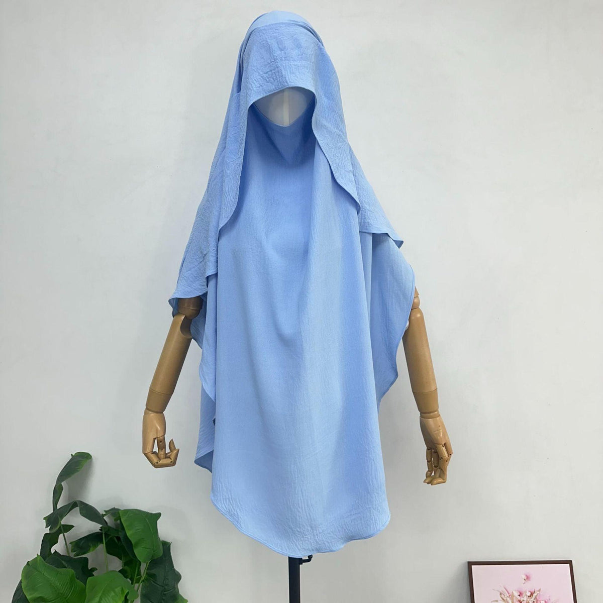 Women’s draped scarf shawl cover with hooded neckline, light blue shade