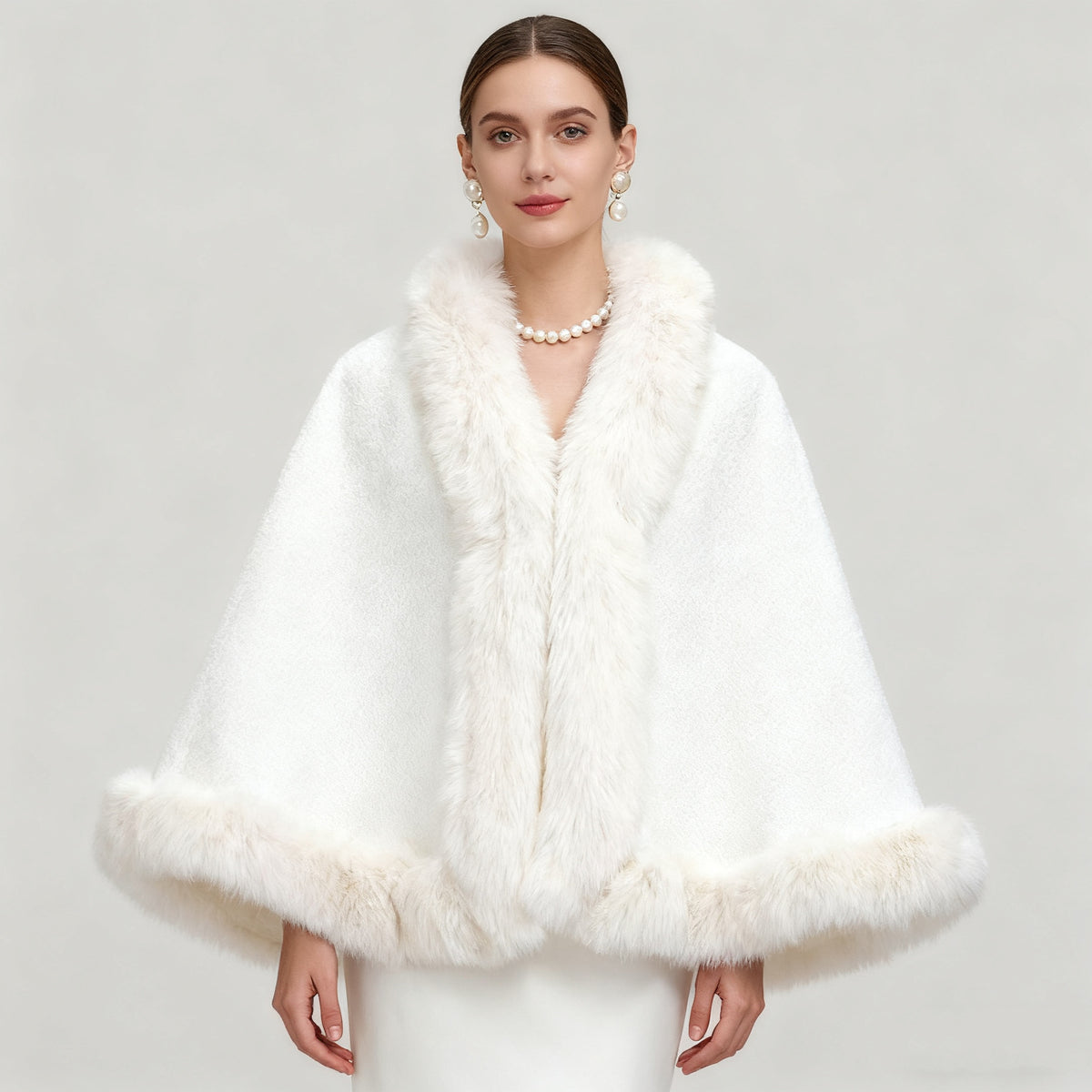 White cape shawl with faux mink-fur collar, open front design, and plush fur hem