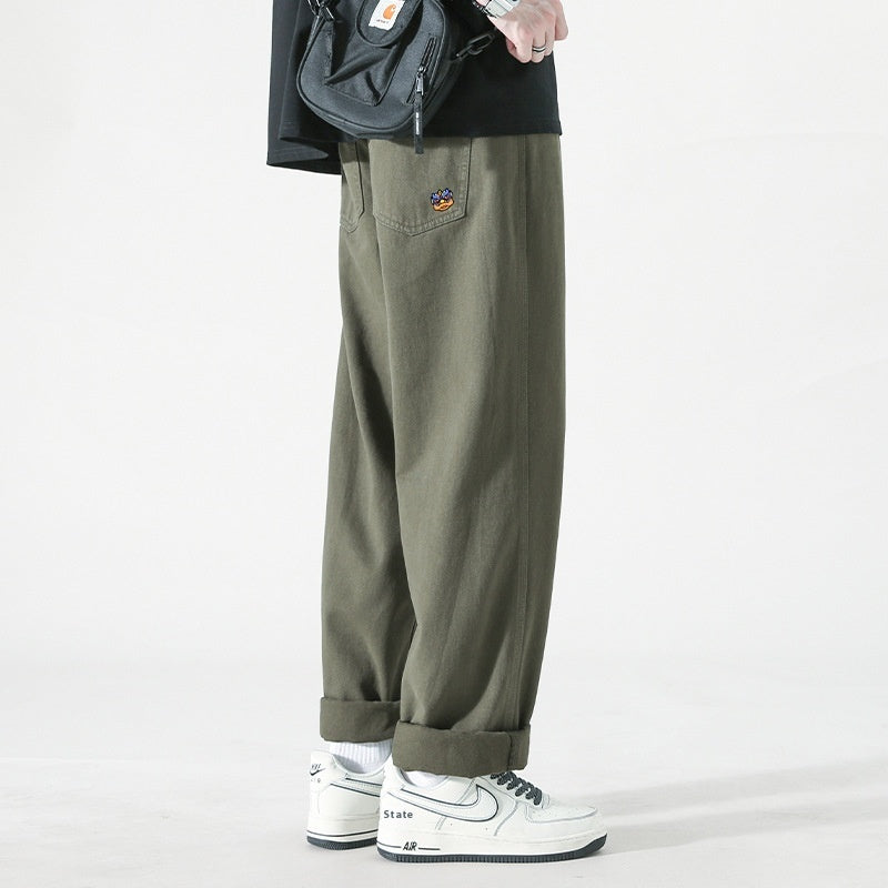 Men's loose cargo pants in army green, straight leg, cuffed hems, small embroidered patch