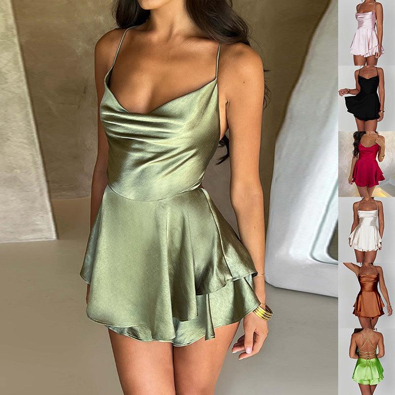 Metallic green satin mini skirt with thin spaghetti straps and flared hem