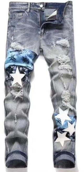 Light blue washed jeans with rips and blue-and-white star patch prints