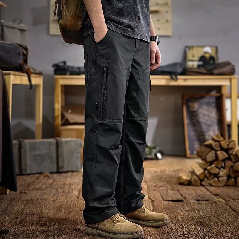 Black paratrooper cargo trousers with side zip pocket and cargo utility panels