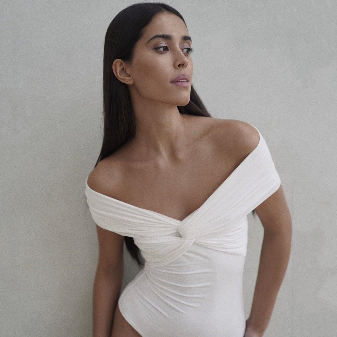 White off-shoulder V-neck jumpsuit with ruched cross-front knot bodice