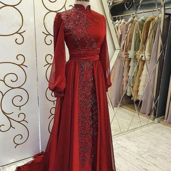Red stand-collar long-sleeve evening dress with embellished bodice and sheer patterned skirt