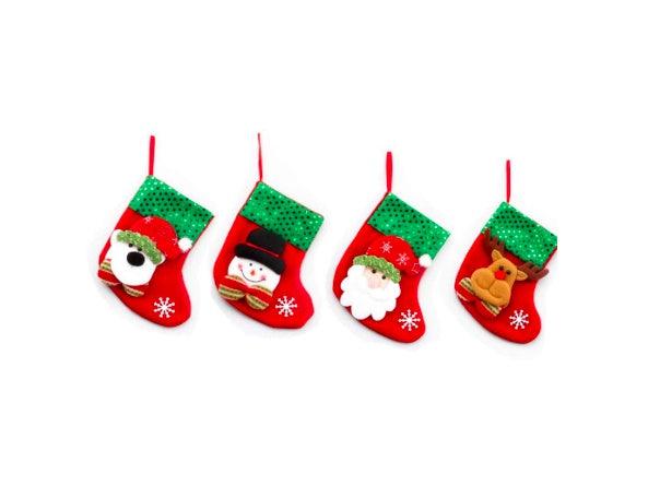 Four mini Christmas stockings in red and green with winter character faces