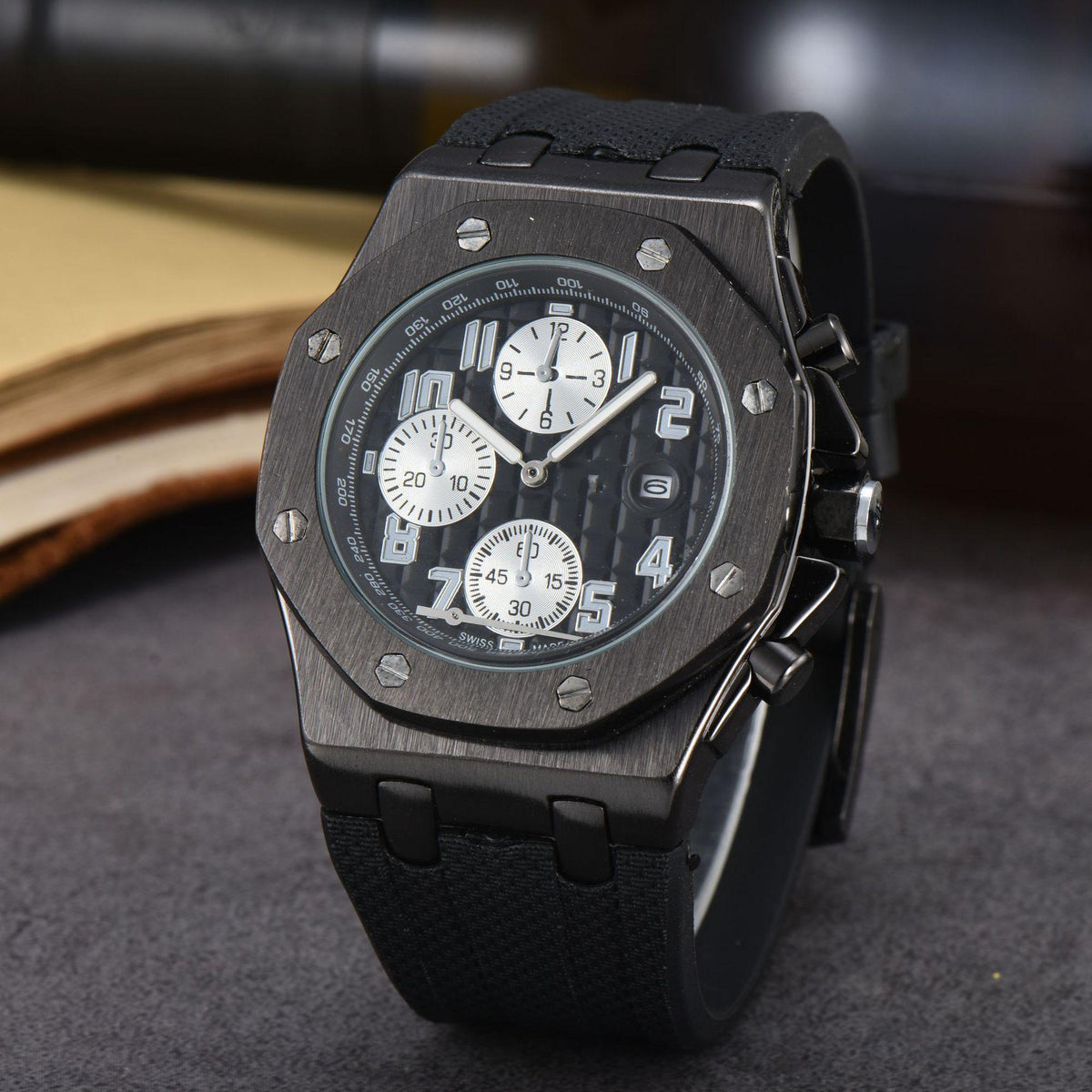 Sports quartz wristwatch with dark gunmetal case and black textured silicone strap
