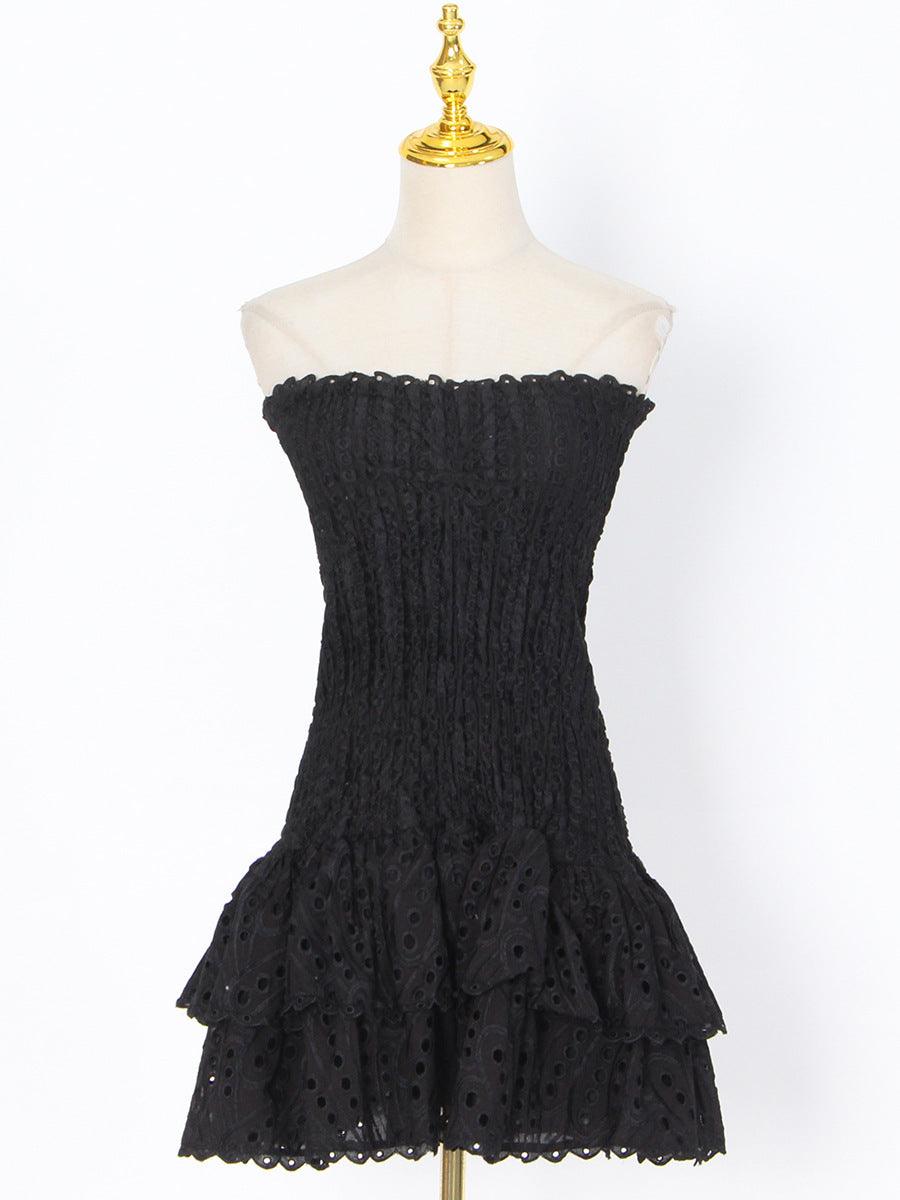Black strapless tube top mini dress with smocked bodice and ruffled hem