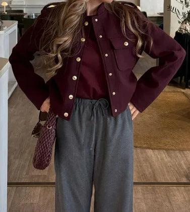 Dark red cropped stand-collar jacket with gold buttons and flap chest pocket
