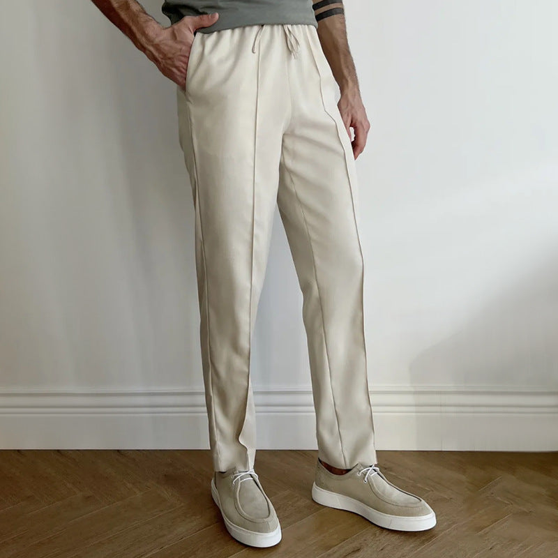 Men's pleated twill slim-fit tapered pants with elastic waist, khaki-beige