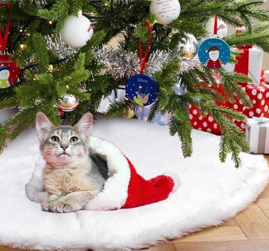 White plush Christmas tree skirt with round edge and center opening