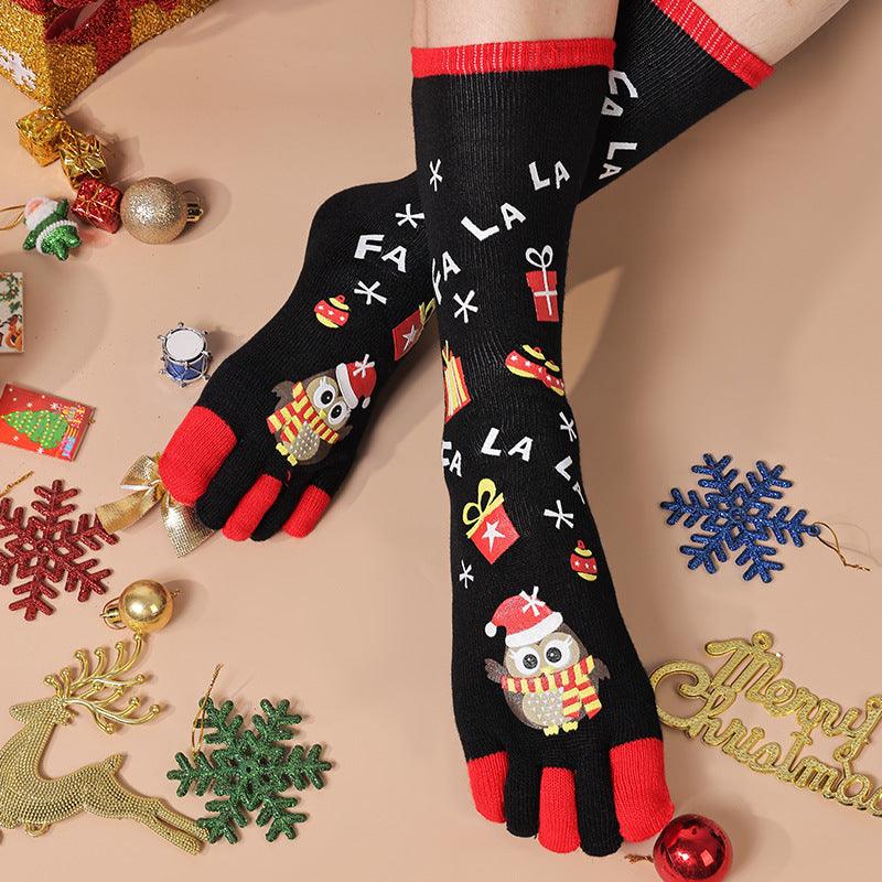 Christmas five-toe socks in black and red with penguin and FA LA LA lettering