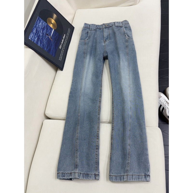 Medium light blue wide-leg jeans with curved seam and faded panels