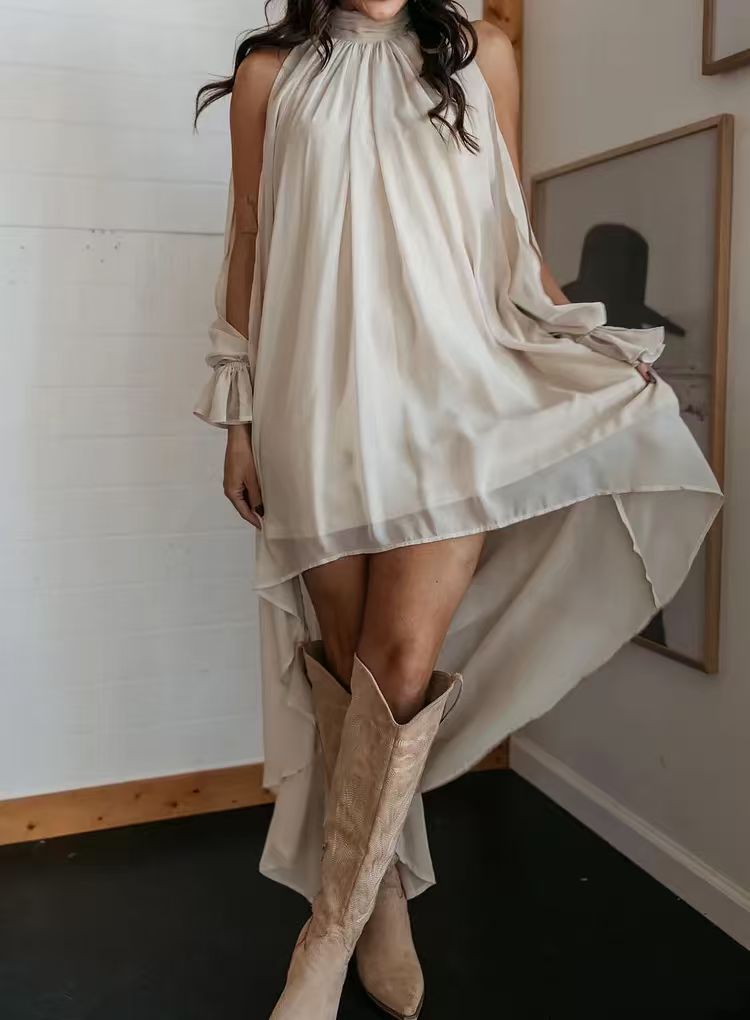 Beige high-neck chiffon mini dress with asymmetrical layered hem and soft drape.