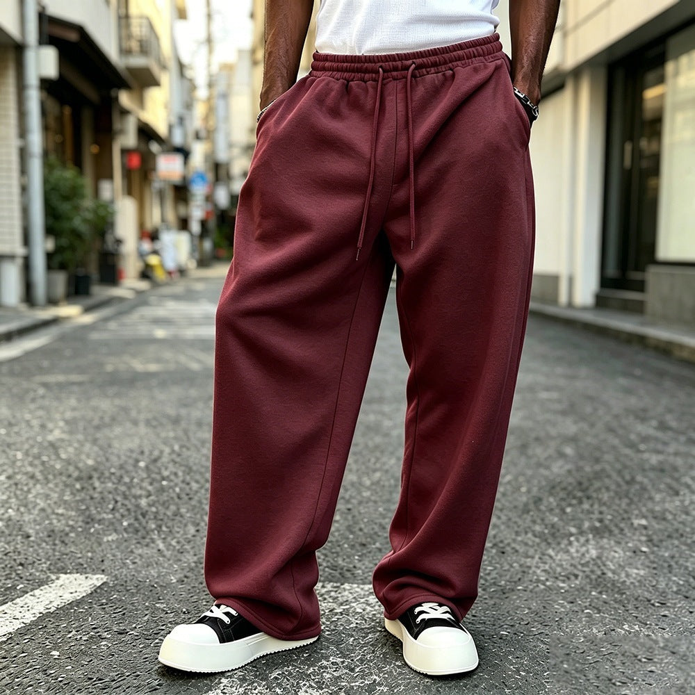 Wine/burgundy elastic-waist sweatpants with drawstring and relaxed straight-leg fit.