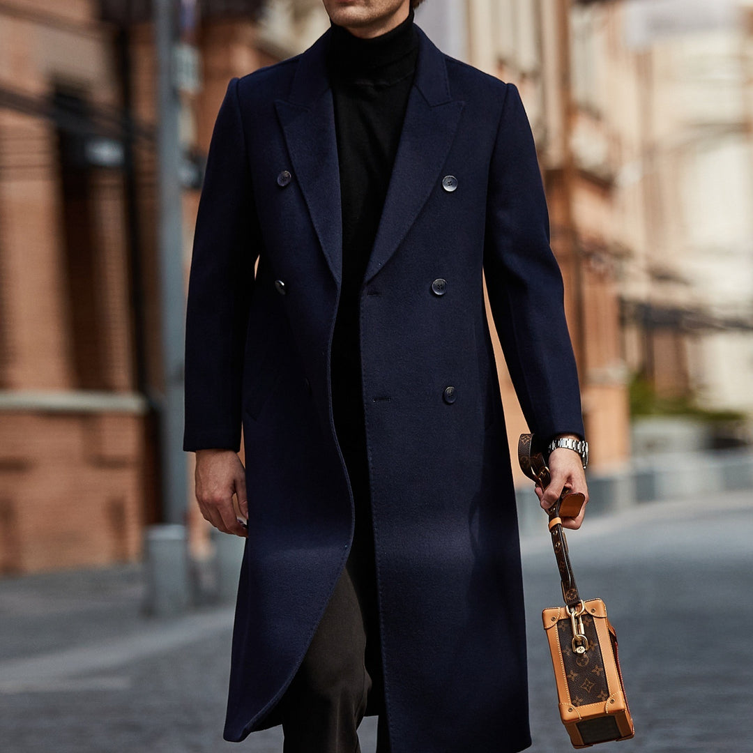 Navy double-breasted long wool coat with peak lapels and dark button front
