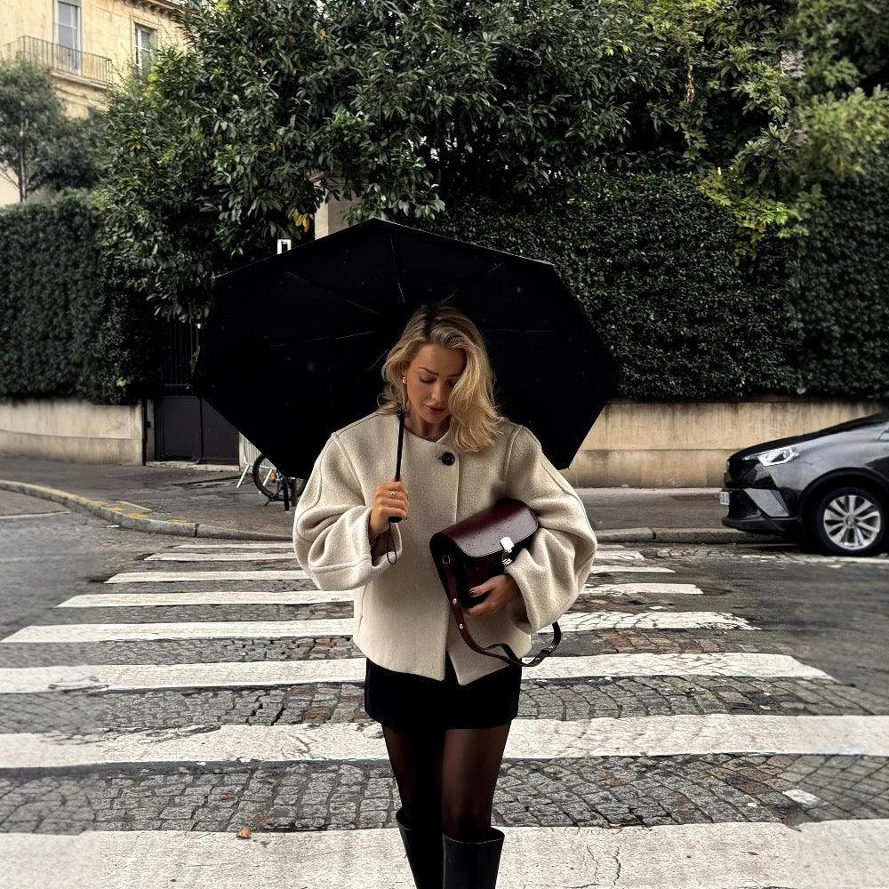 Women's off-white padded wool coat with square neck, long sleeves, button front