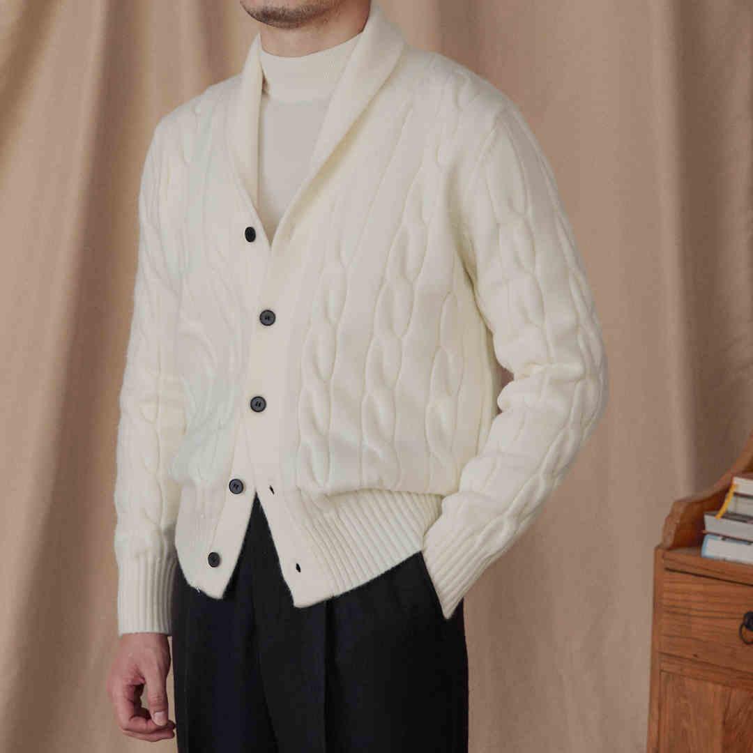 Cream twisted cable knit cardigan sweater with button placket and ribbed hem cuffs