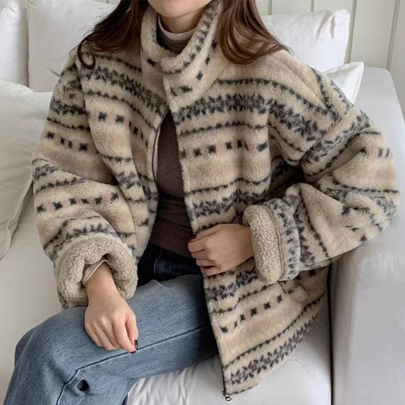 Women’s lamb wool coat in light beige with patterned zip-up design and stand collar