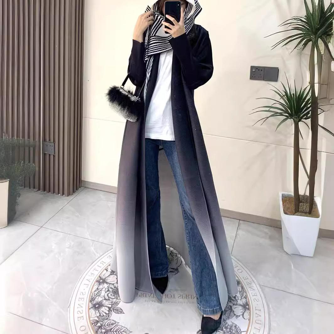 Long dark coat cloak with open front, striped scarf, and side pockets