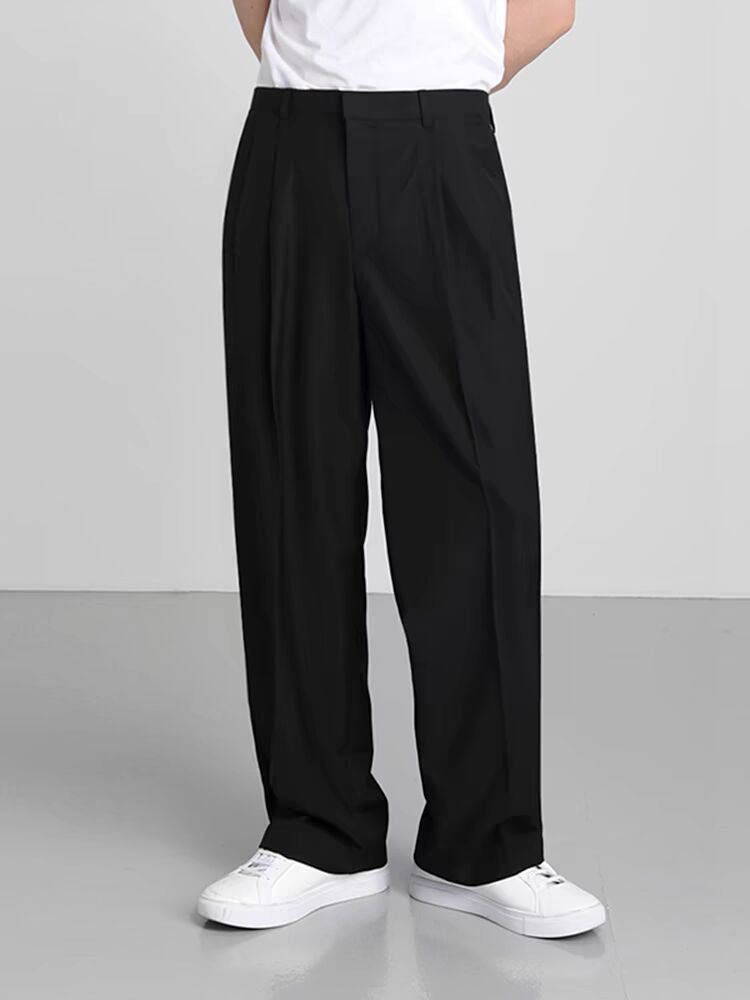 Black wide-leg suit trousers with pleated front, draped straight legs