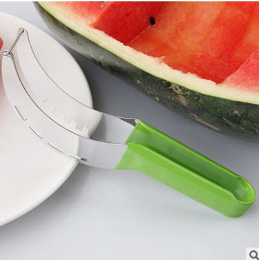 Watermelon cutter with green handle next to sliced watermelon half on plate.