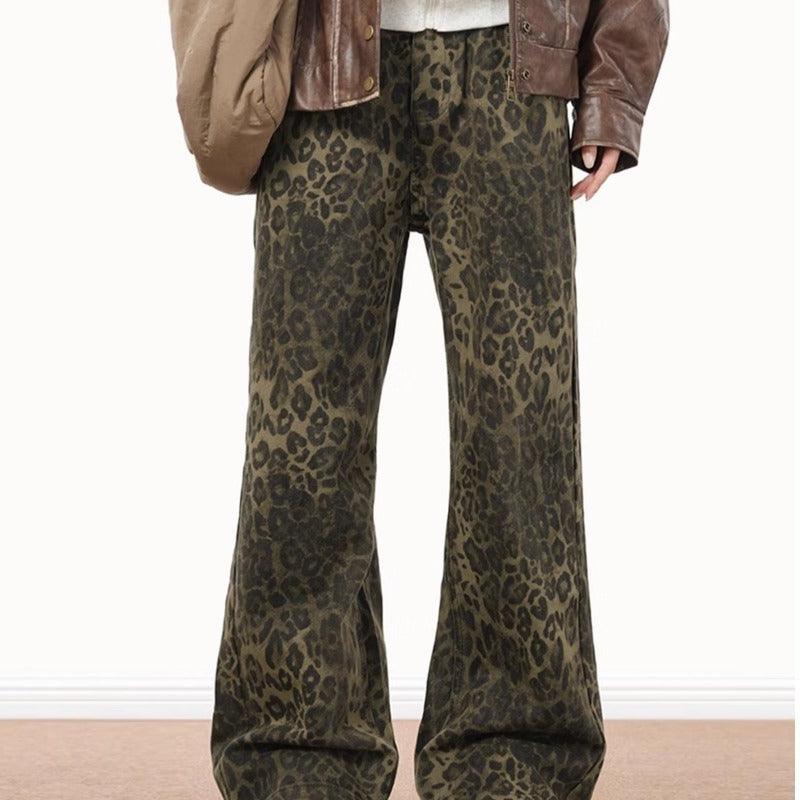 Men's leopard print denim jeans with wide straight legs and dark olive animal print