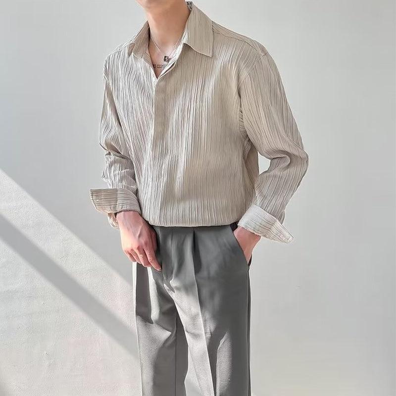 Men’s long-sleeve loose shirt in light beige with pointed collar and vertical stripe texture.