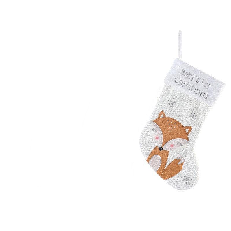 White baby’s first Christmas wool stocking with orange fox applique and “Baby’s 1st Christmas” text