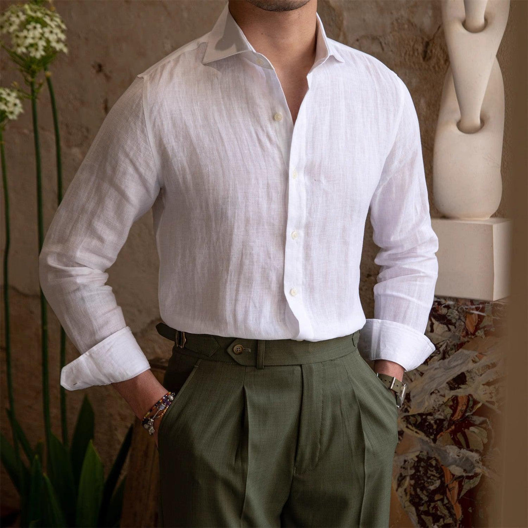 White button-up long sleeve shirt with pointed collar and front placket