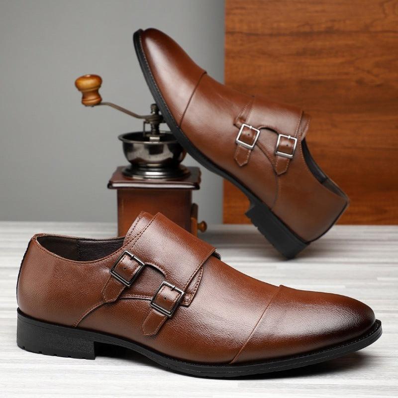Pointed leather dress shoes in brown with two side buckle straps and black sole