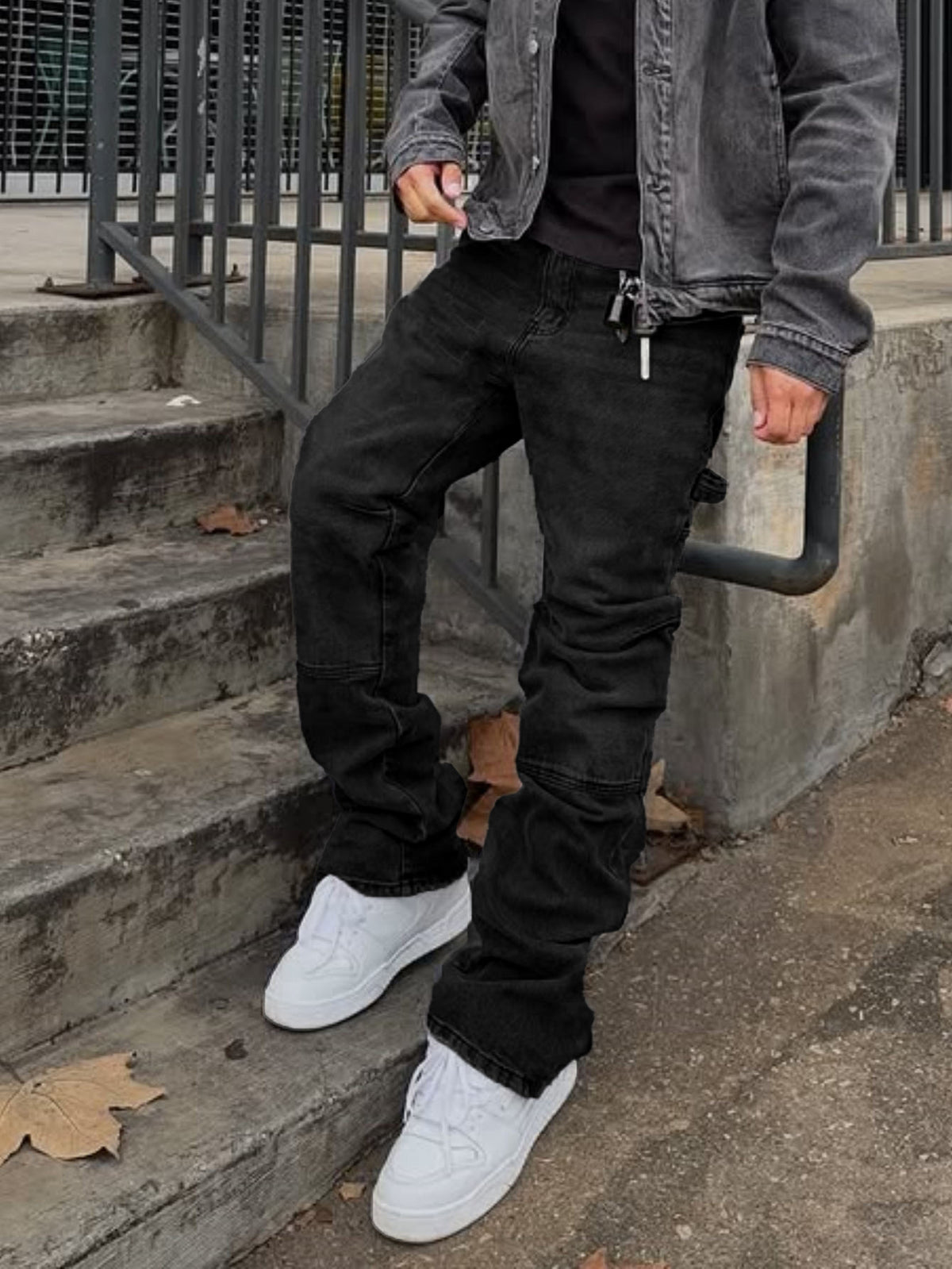 Black ripped hip cargo stretch bootcut trousers with flap pockets and cuffed hems