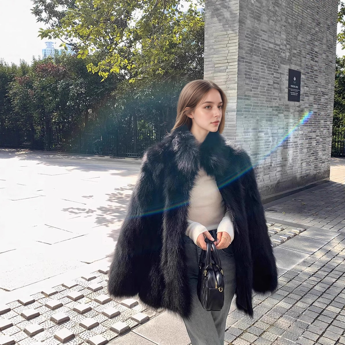 Black faux fur overcoat with wide collar and full-length sleeves