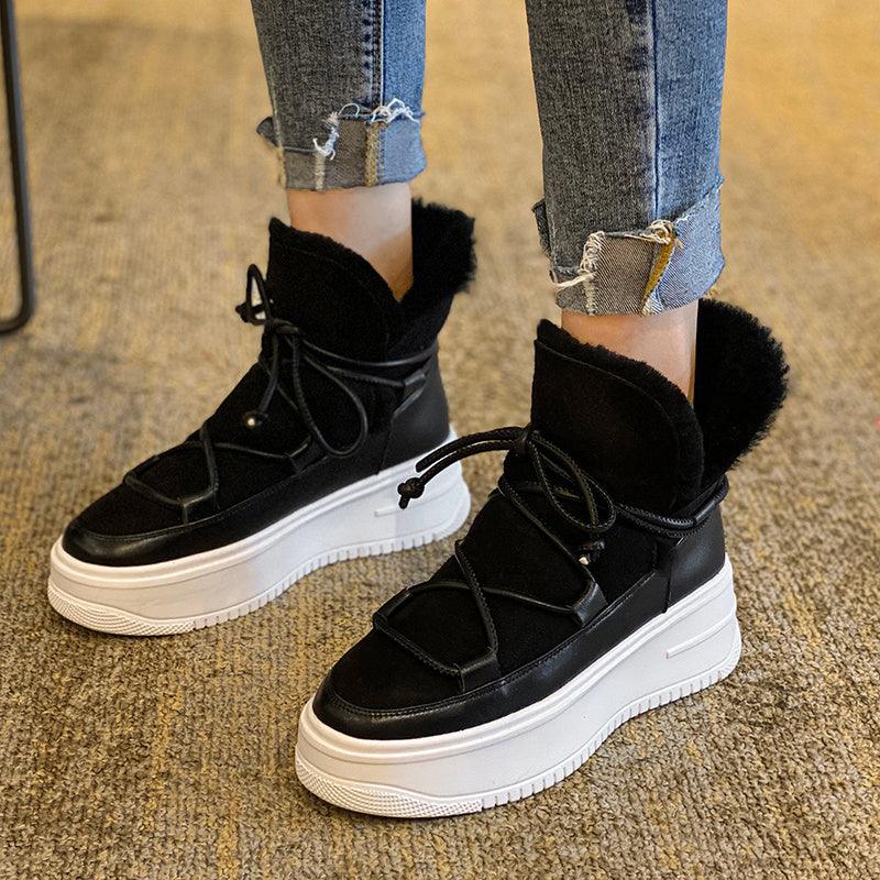 Black plush fleece warm boots with lace-up front and thick white platform sole.