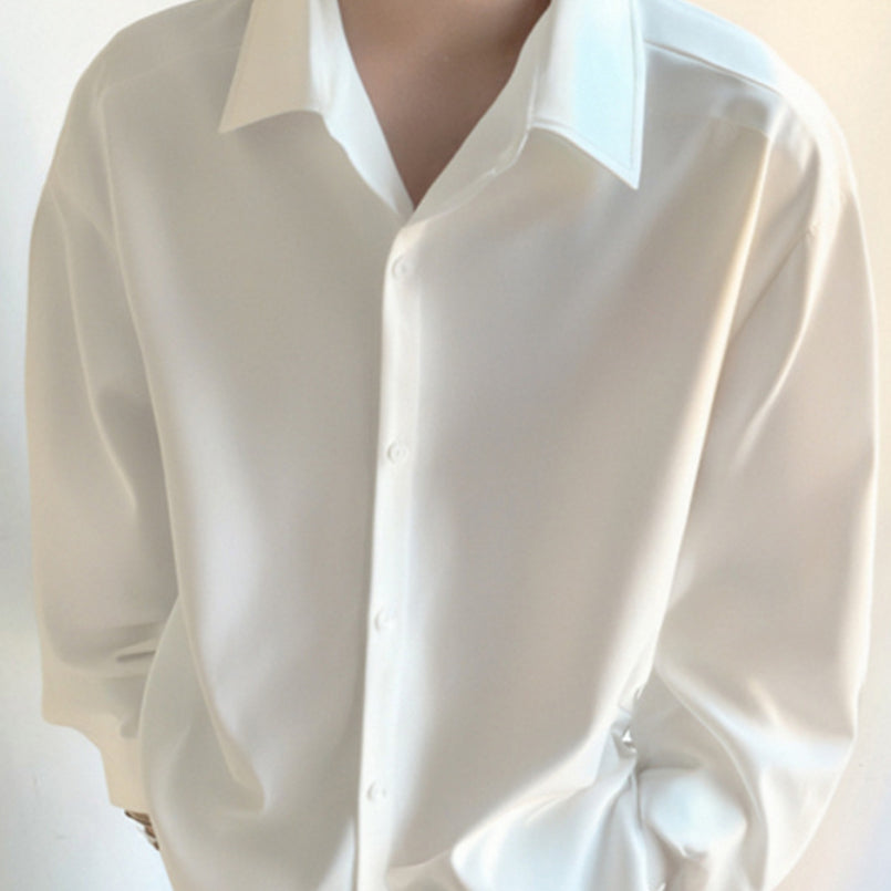 White button-up casual shirt with pointed collar and long sleeves