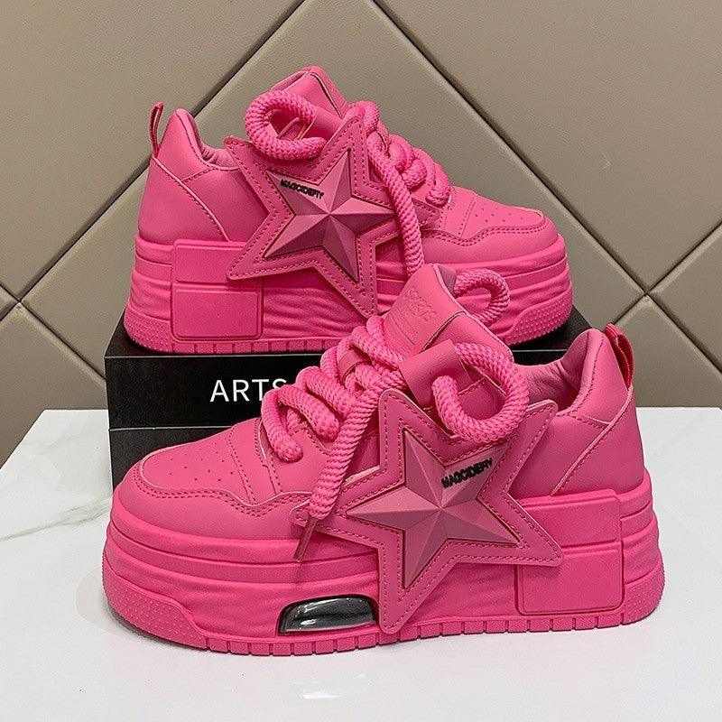 Women's pink platform sneakers with lace-up closure and chunky cushioned sole