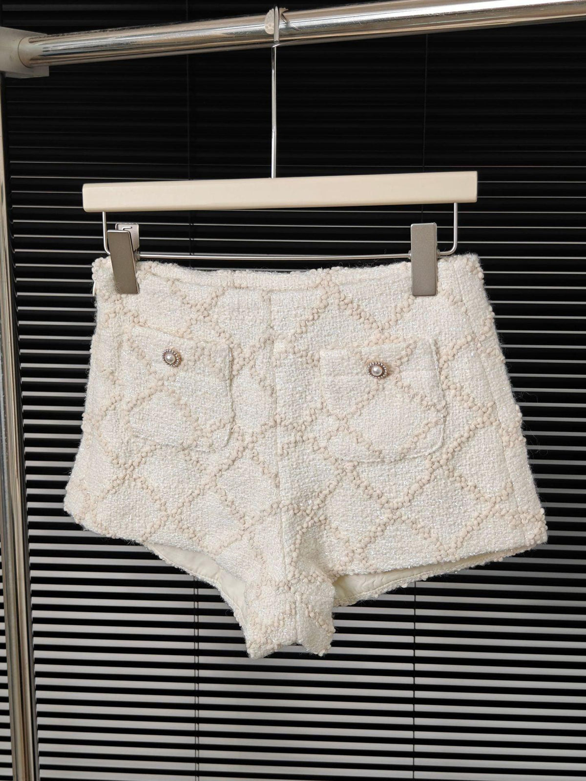 Diamond plaid tweed shorts with button details, light cream