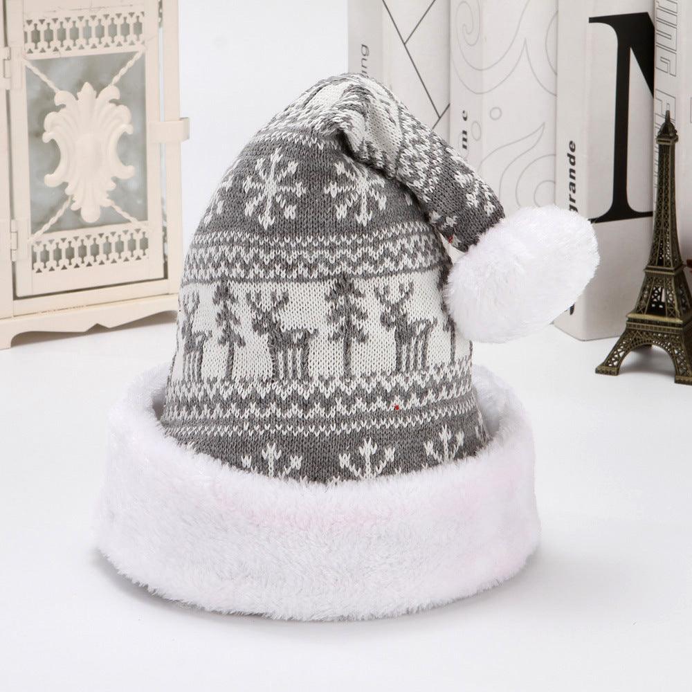 Gray Christmas knit hat with white pom-pom and deer fair isle pattern with snowflakes