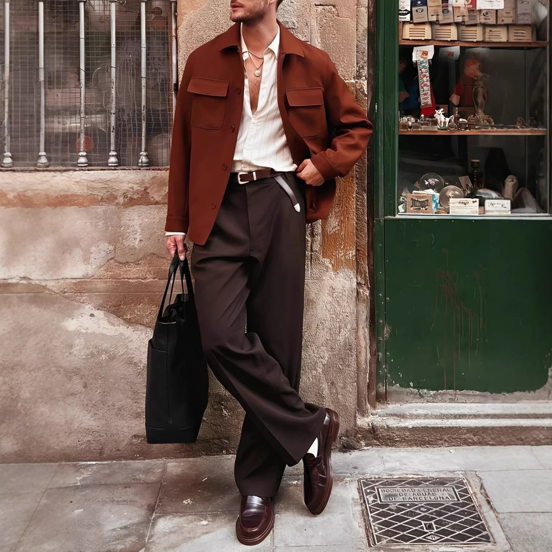 Men's brown dress trousers worn with belt; button front and side pockets