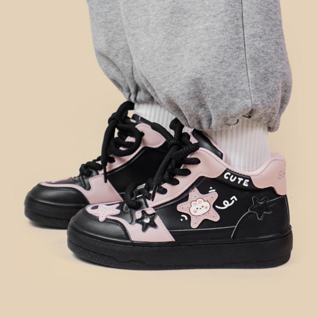 Black high-top lace sneakers with pink accents, cute graphic patches, chunky rubber sole
