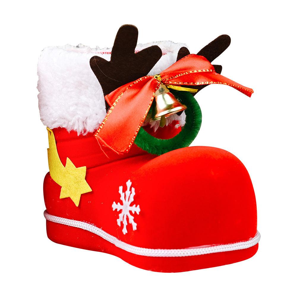 Red Santa-style boot ornament with white fur trim, yellow star, and orange ribbon