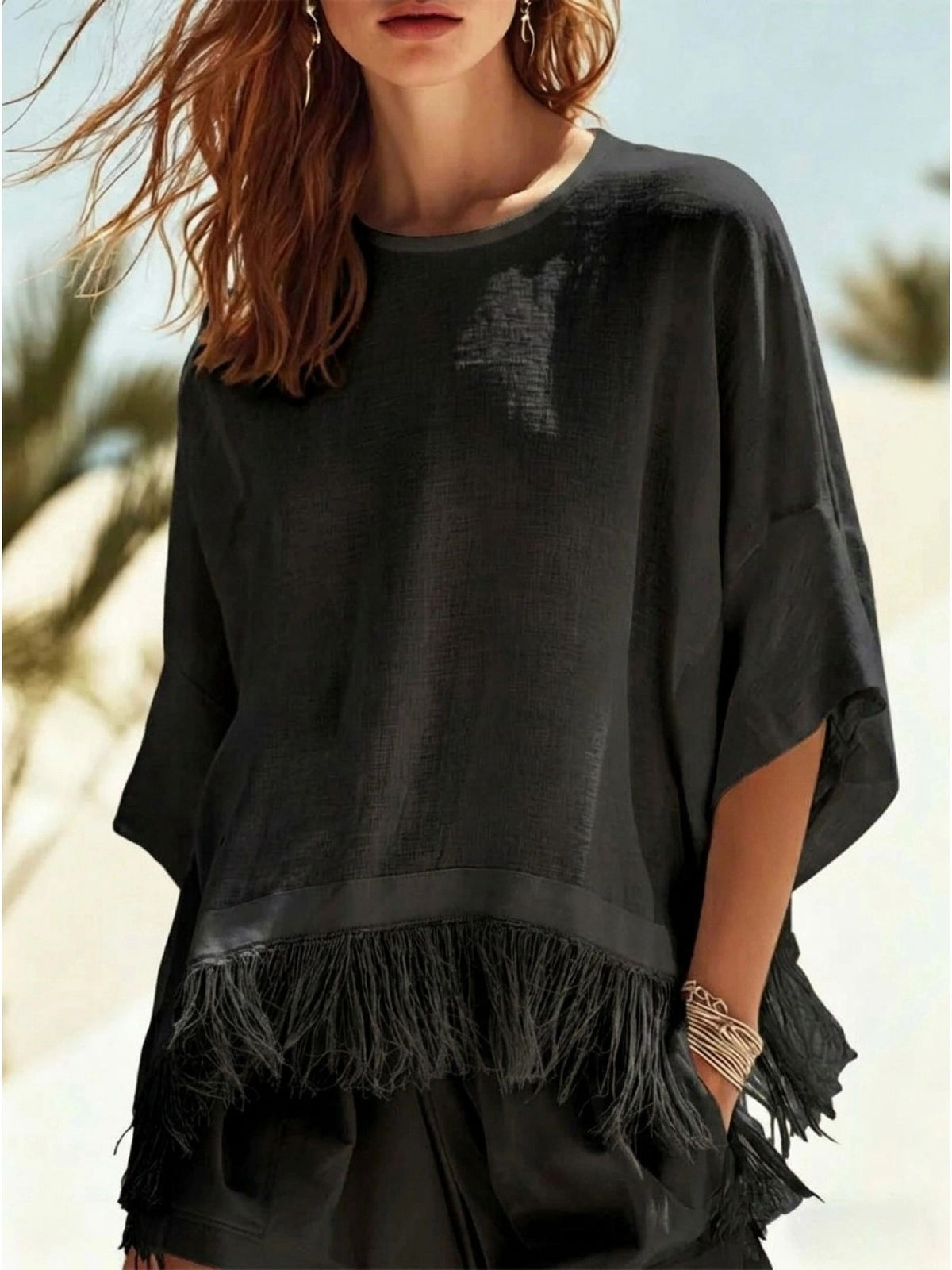 Black crew-neck fringe mid-sleeve t-shirt with tassel hem trim