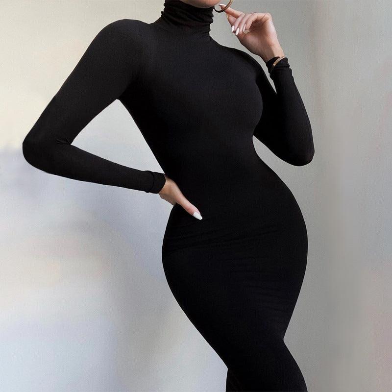 Black fleece-lined long-sleeve yoga jumpsuit with mock neck and fitted waist
