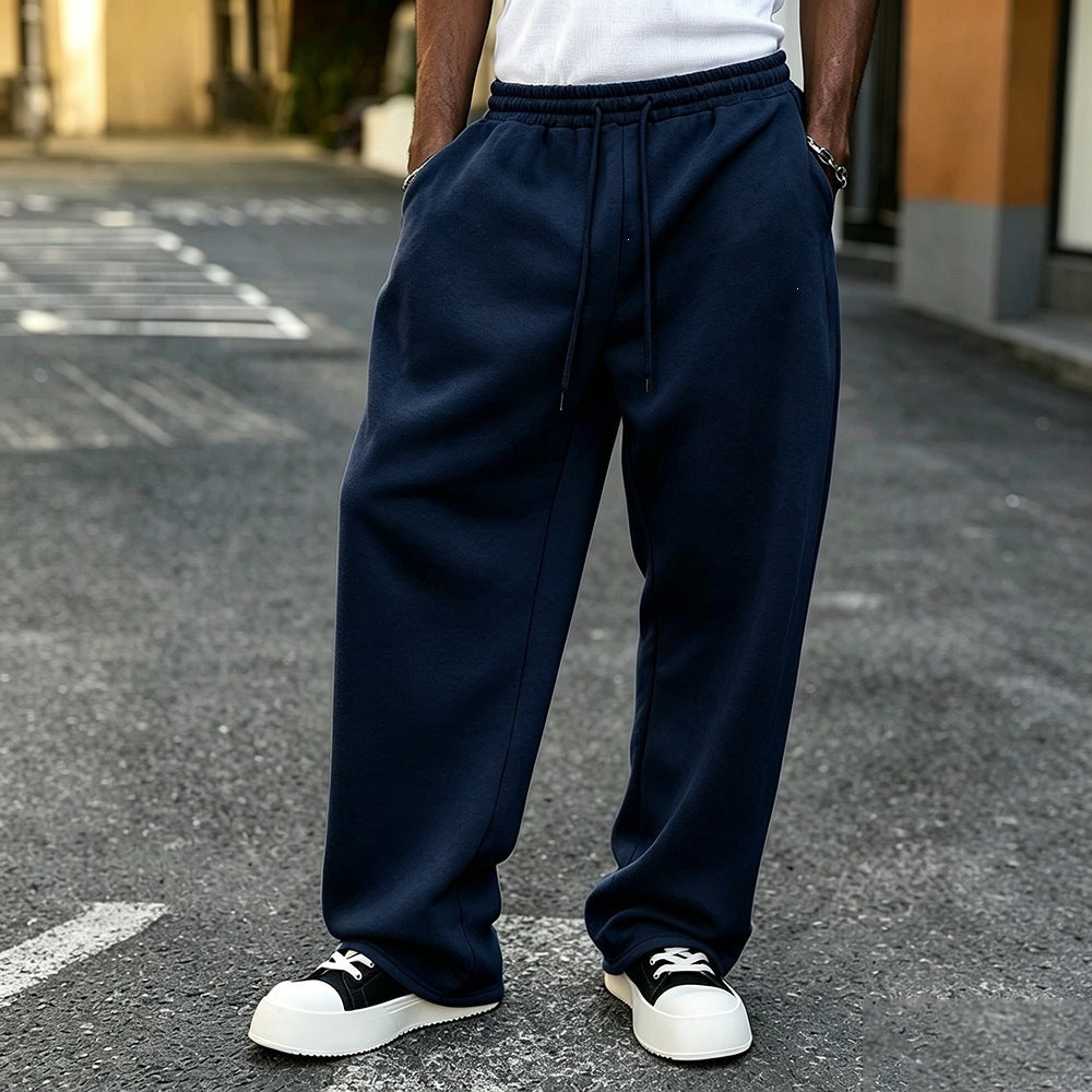 Fleece-lined loose sweatpants with elastic drawstring waist, navy blue, relaxed straight fit